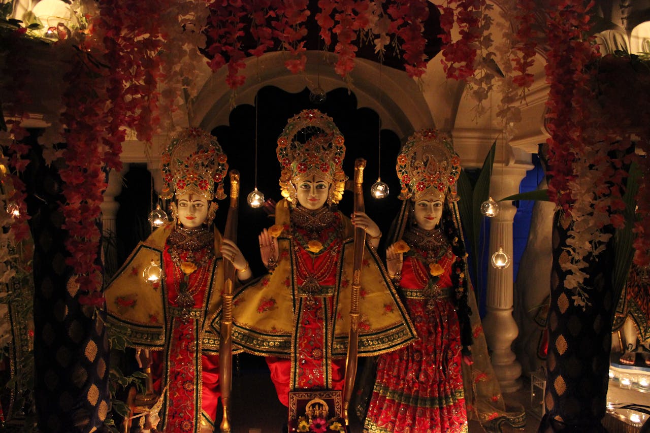 Beautifully adorned deity statues with vibrant decorations for Diwali celebration.